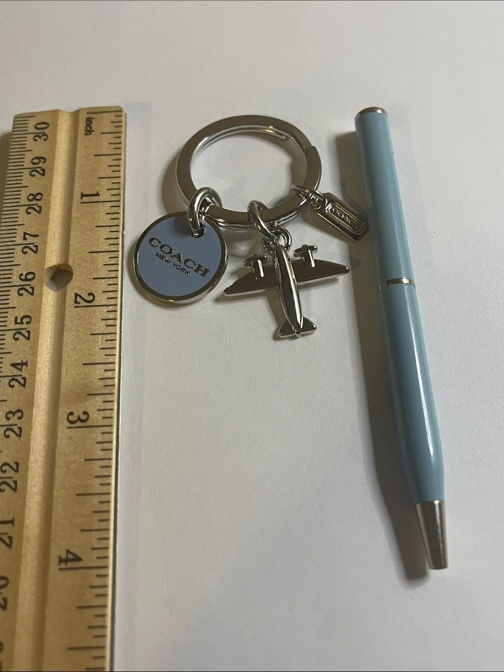 Coach Silver Airplane Keyring with Light Blue Round Charm and Coach Pen